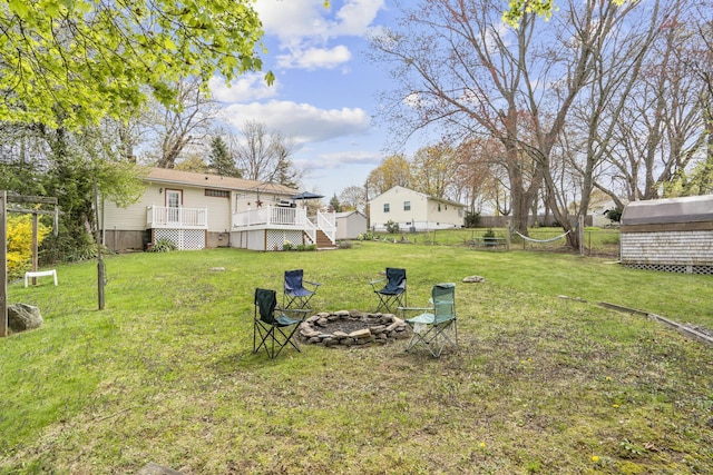 98 Cynthia Dr, West Haven, CT 06516 - view of yard with a wooden deck, fence, and an outdoor fire pit