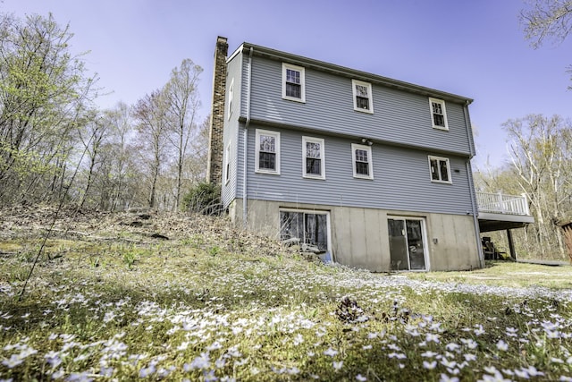 16 November Trl, Haddam, CT 06438 - rear view of property with a chimney, a wooden deck, and a carport