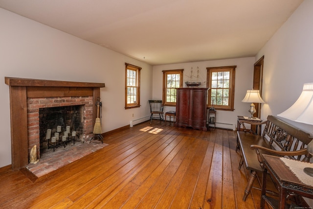 16 November Trl, Haddam, CT 06438 - living room featuring hardwood / wood-style floors, a fireplace, and a baseboard radiator