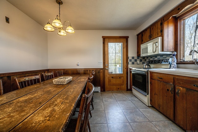 16 November Trl, Haddam, CT 06438 - kitchen featuring a wainscoted wall, electric stove, white microwave, and a wealth of natural light