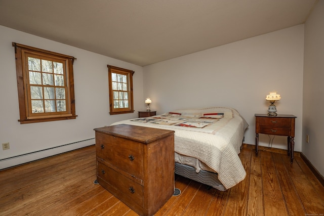 16 November Trl, Haddam, CT 06438 - bedroom featuring baseboards, a baseboard heating unit, and wood-type flooring