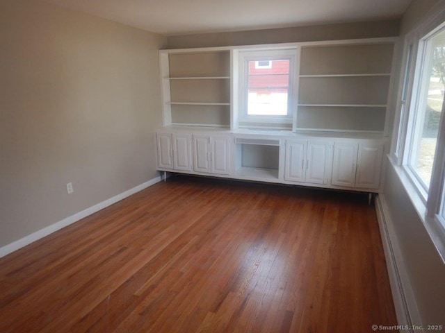 48 W Vine St, Stonington, CT 06379 - empty room with dark wood finished floors and baseboards