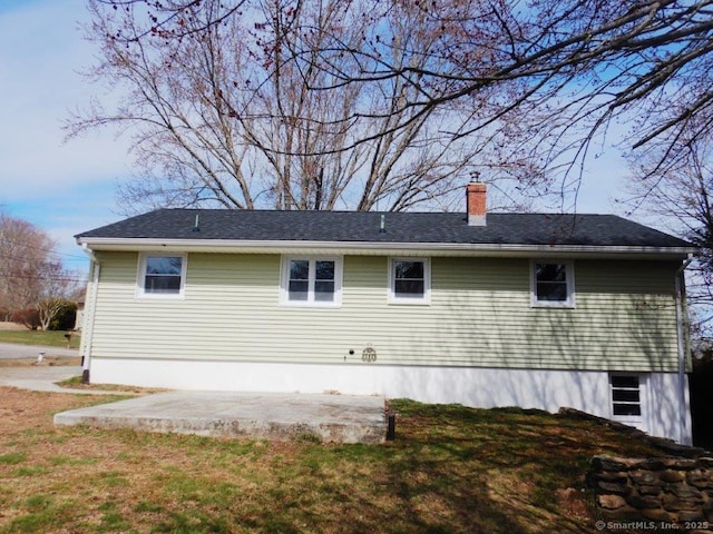 48 W Vine St, Stonington, CT 06379 - view of side of home with a patio area, a chimney, and a yard