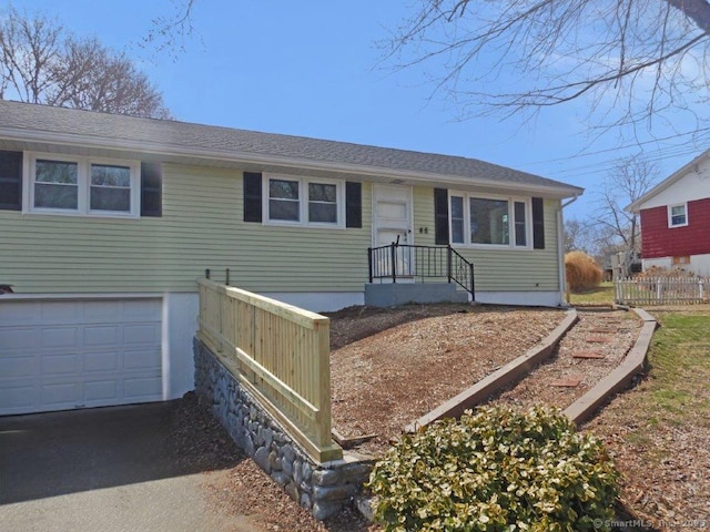 48 W Vine St, Stonington, CT 06379 - ranch-style house featuring fence, aphalt driveway, and a garage