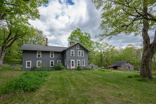 469 Platt Hill Rd, Winchester, CT 06098 - rear view of house with a chimney and a lawn
