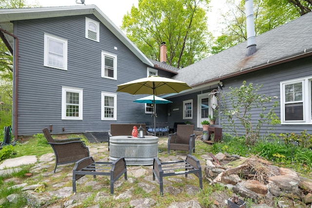 469 Platt Hill Rd, Winchester, CT 06098 - back of house with a chimney, an outdoor living space, and a patio