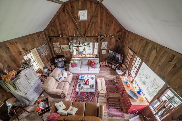 469 Platt Hill Rd, Winchester, CT 06098 - living room with wood finished floors, wood walls, high vaulted ceiling, and a healthy amount of sunlight
