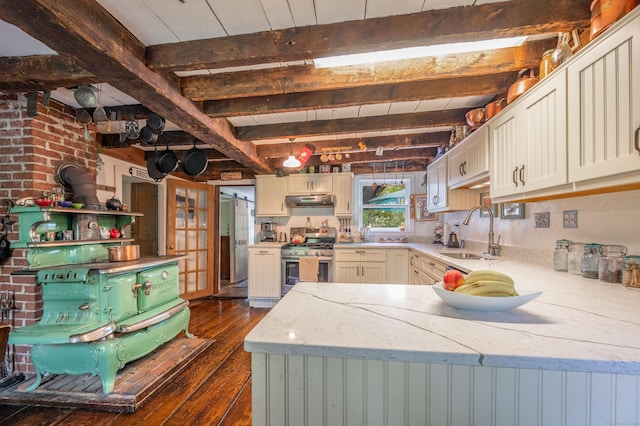 469 Platt Hill Rd, Winchester, CT 06098 - kitchen with stainless steel range with gas cooktop, a sink, dark wood-style flooring, light stone countertops, and beam ceiling