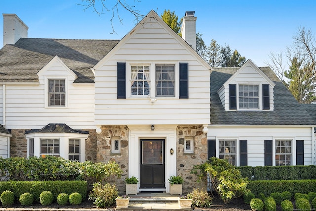 9 High Ridge Rd, Wilton, CT 06897 - view of front of home featuring a chimney, stone siding, and a shingled roof