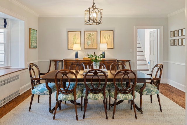 9 High Ridge Rd, Wilton, CT 06897 - dining space with stairway, crown molding, radiator heating unit, and wood finished floors