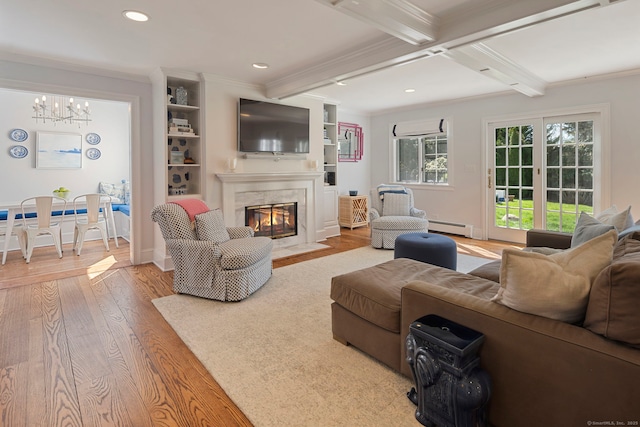 9 High Ridge Rd, Wilton, CT 06897 - living room featuring beamed ceiling, a chandelier, crown molding, wood finished floors, and a baseboard radiator