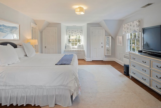 9 High Ridge Rd, Wilton, CT 06897 - bedroom with vaulted ceiling, wood finished floors, visible vents, and baseboards