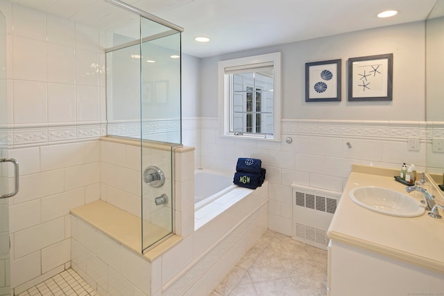 9 High Ridge Rd, Wilton, CT 06897 - bathroom with radiator heating unit, a bath, tile patterned flooring, and a shower stall