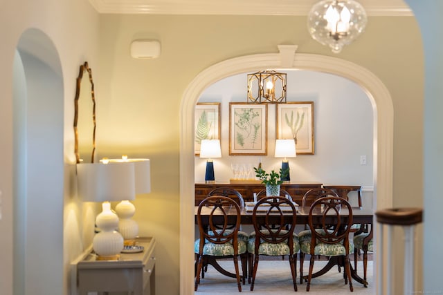 9 High Ridge Rd, Wilton, CT 06897 - dining space with arched walkways, a dry bar, ornamental molding, and an inviting chandelier