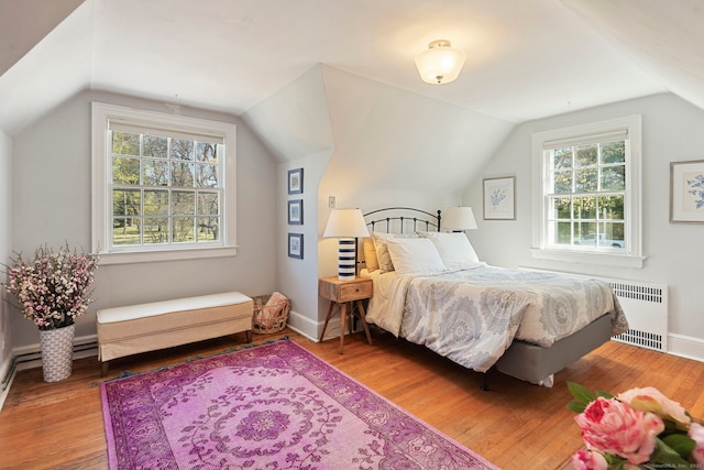 9 High Ridge Rd, Wilton, CT 06897 - bedroom with vaulted ceiling, radiator heating unit, baseboards, and wood finished floors