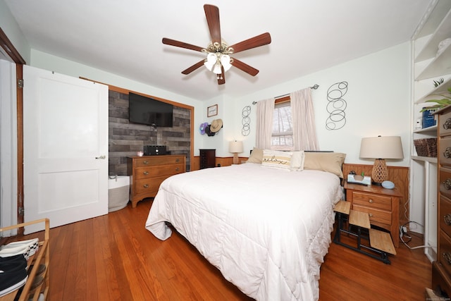 bedroom with a ceiling fan and wood finished floors