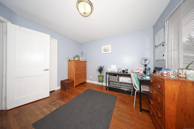 home office with wood finished floors and baseboards