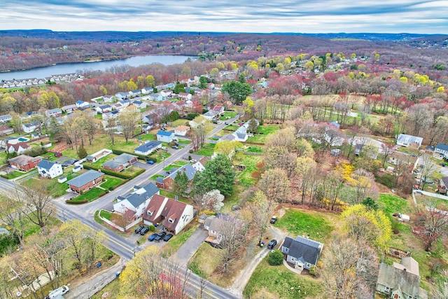 drone / aerial view featuring a residential view and a water view