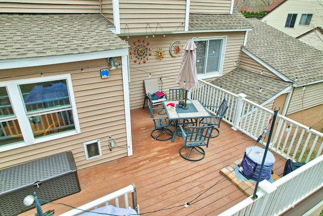 wooden deck with outdoor dining space