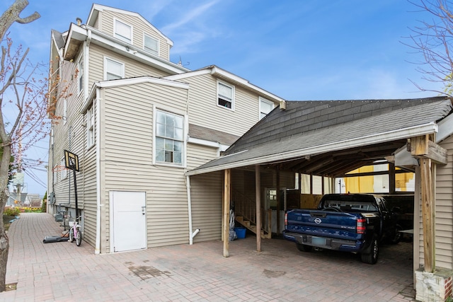 exterior space with a carport