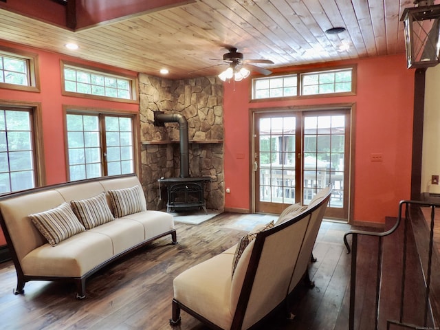 190 Wickham Rd, East Haddam, CT 06423 - living area with wooden ceiling, a wood stove, a ceiling fan, plenty of natural light, and hardwood / wood-style flooring