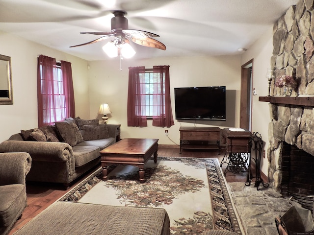 190 Wickham Rd, East Haddam, CT 06423 - living area featuring ceiling fan, wood finished floors, and a stone fireplace