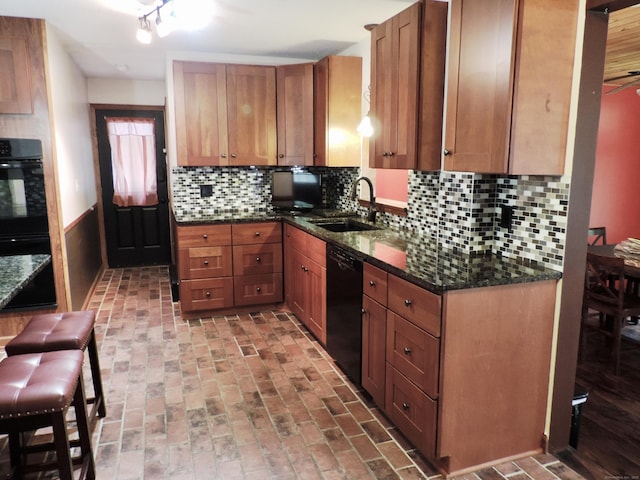 190 Wickham Rd, East Haddam, CT 06423 - kitchen with black appliances, a sink, dark stone countertops, backsplash, and brown cabinets
