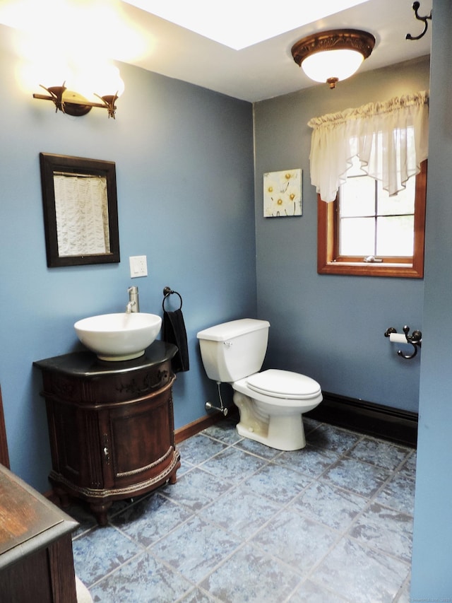 190 Wickham Rd, East Haddam, CT 06423 - half bathroom featuring vanity, toilet, and baseboards