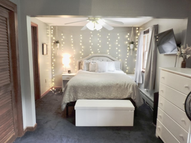 190 Wickham Rd, East Haddam, CT 06423 - bedroom with baseboards, dark carpet, baseboard heating, and a ceiling fan
