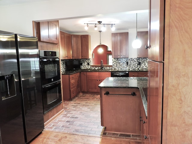 190 Wickham Rd, East Haddam, CT 06423 - kitchen featuring black appliances, a sink, backsplash, brown cabinetry, and pendant lighting