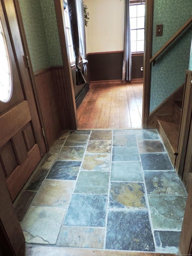 190 Wickham Rd, East Haddam, CT 06423 - interior space featuring stone tile flooring, a wainscoted wall, wallpapered walls, and stairway
