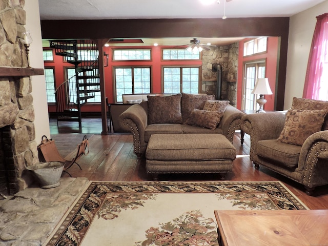 190 Wickham Rd, East Haddam, CT 06423 - living room with a wood stove, hardwood / wood-style floors, ceiling fan, and stairs