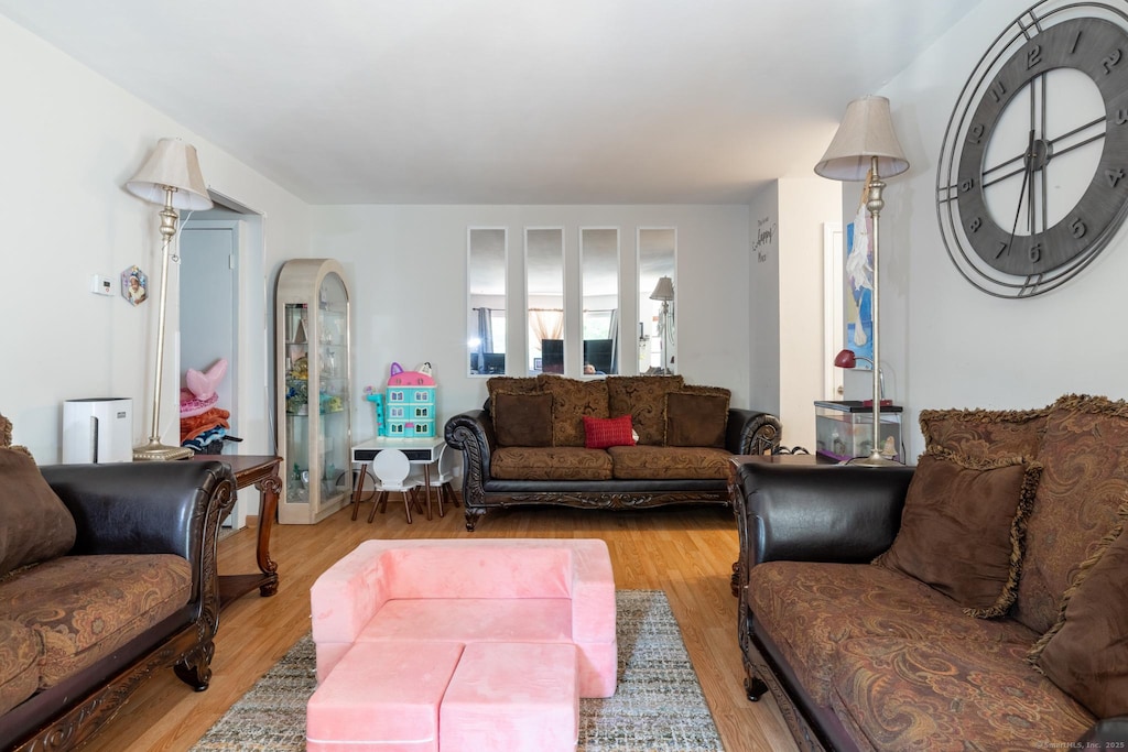 333 Vincellette St Unit 44, Bridgeport, CT 06606 - living room with light wood-type flooring and arched walkways