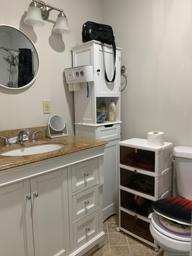 333 Vincellette St Unit 44, Bridgeport, CT 06606 - bathroom featuring toilet, vanity, and tile patterned floors