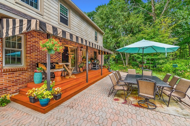view of patio featuring a deck and outdoor dining area