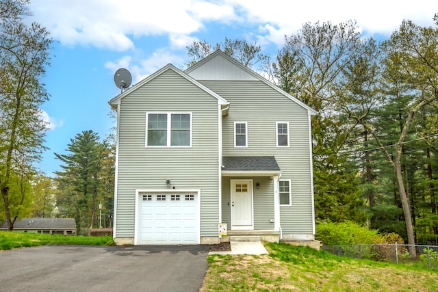 3 Henry Rd, Enfield, CT 06082 - view of front of house featuring an attached garage, aphalt driveway, and fence