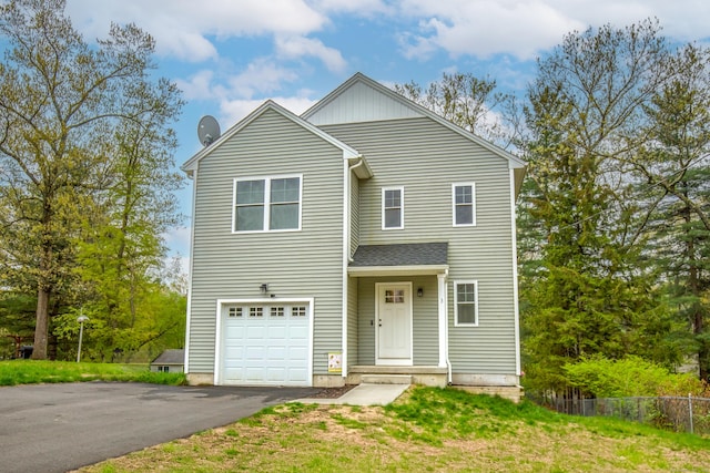 3 Henry Rd, Enfield, CT 06082 - view of front facade featuring fence, an attached garage, and aphalt driveway
