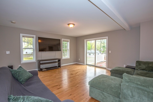 3 Henry Rd, Enfield, CT 06082 - living room featuring baseboards, light wood finished floors, and beamed ceiling