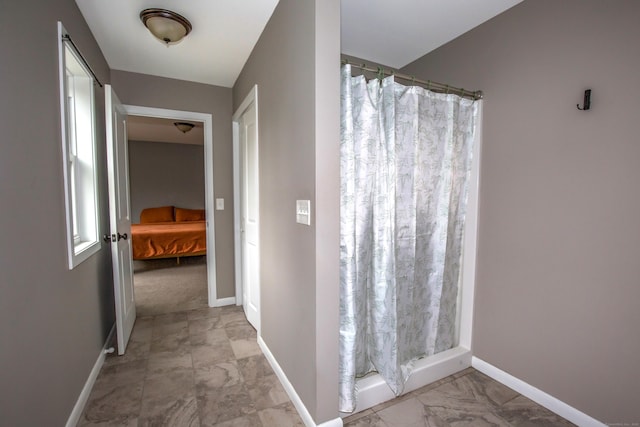 3 Henry Rd, Enfield, CT 06082 - full bathroom featuring baseboards, marble finish floor, and a shower with shower curtain