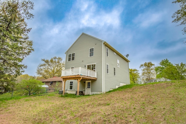 3 Henry Rd, Enfield, CT 06082 - rear view of house featuring a yard, cooling unit, and a wooden deck