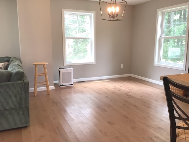 3 Henry Rd, Enfield, CT 06082 - dining space with healthy amount of natural light, wood finished floors, a chandelier, and baseboards