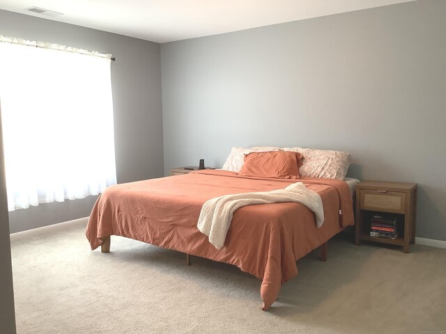 3 Henry Rd, Enfield, CT 06082 - carpeted bedroom with multiple windows and baseboards