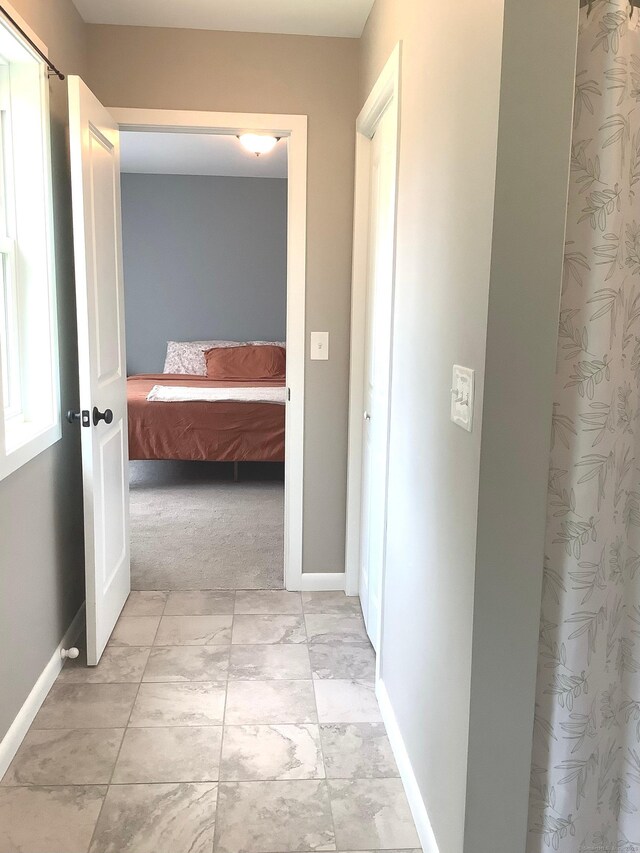 3 Henry Rd, Enfield, CT 06082 - corridor with baseboards and light carpet