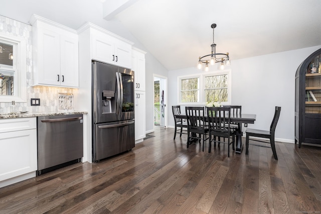 dining area featuring lofted ceiling with beams, an inviting chandelier, dark wood-type flooring, and baseboards