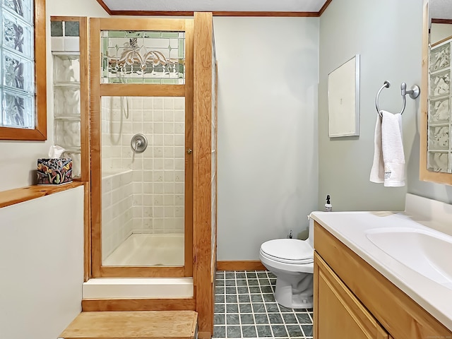 full bathroom with vanity, tile patterned flooring, a stall shower, and toilet