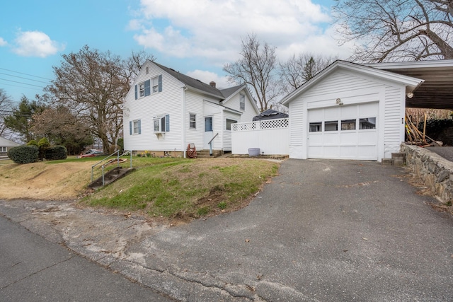 170 Park Rd, Waterbury, CT 06708 - view of property exterior featuring a lawn, driveway, entry steps, and a garage