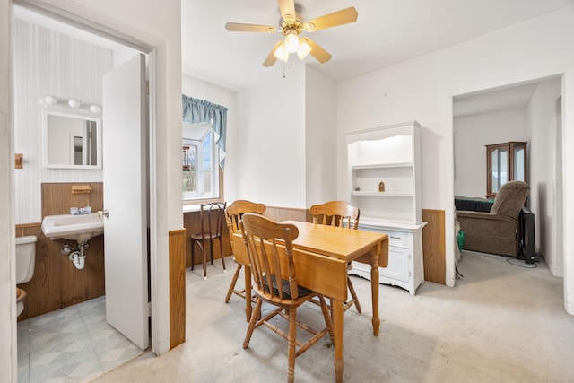 170 Park Rd, Waterbury, CT 06708 - dining area with a wealth of natural light, a wainscoted wall, wooden walls, and ceiling fan