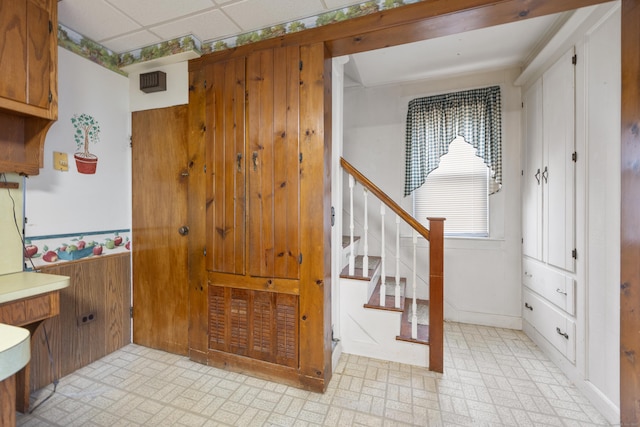 170 Park Rd, Waterbury, CT 06708 - interior space with brick patterned floor, wood walls, and stairway