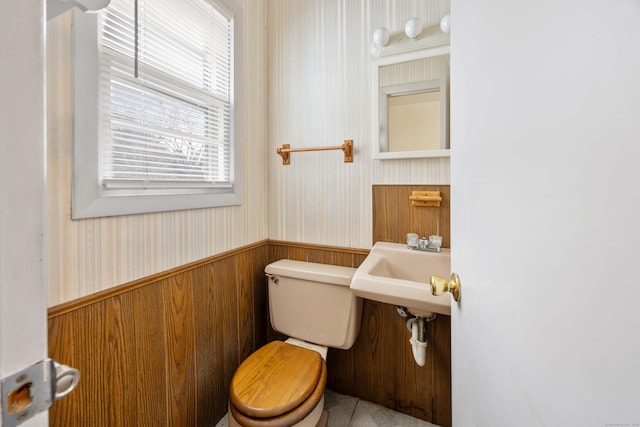 170 Park Rd, Waterbury, CT 06708 - half bathroom featuring wallpapered walls, a wainscoted wall, toilet, and a sink