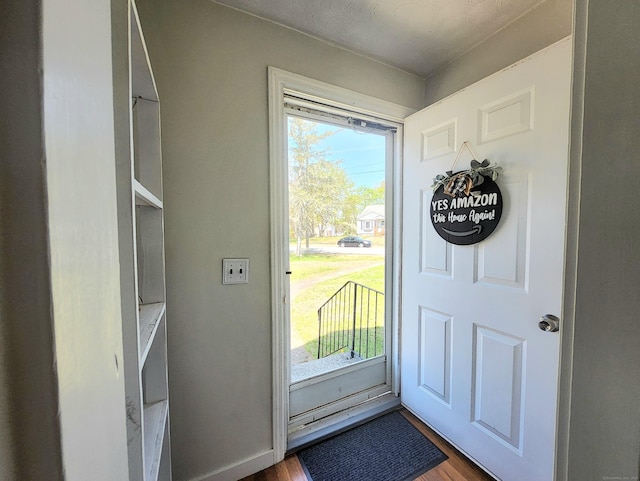 foyer with wood finished floors